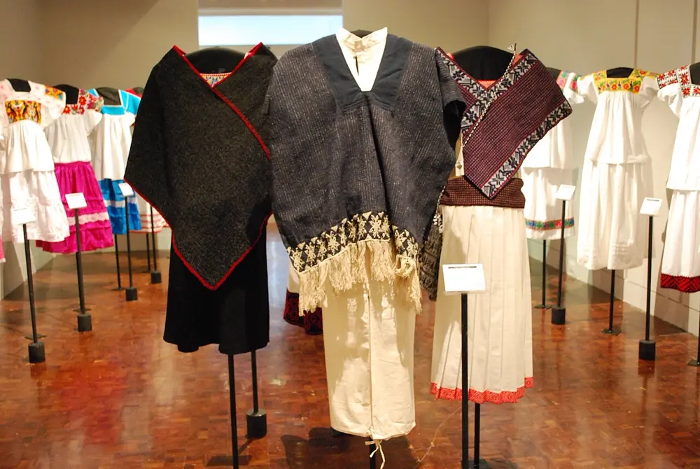 Traditional handwoven Mexican women's clothing on display, reflecting the Mexican fashion heritage this Instagram creator draws from