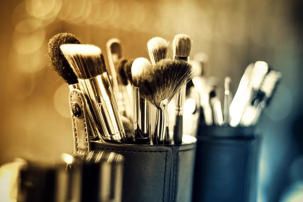 A set of professional makeup brushes in a kit, representing the kind of luxury makeup artistry content glammedbykena shares on Instagram